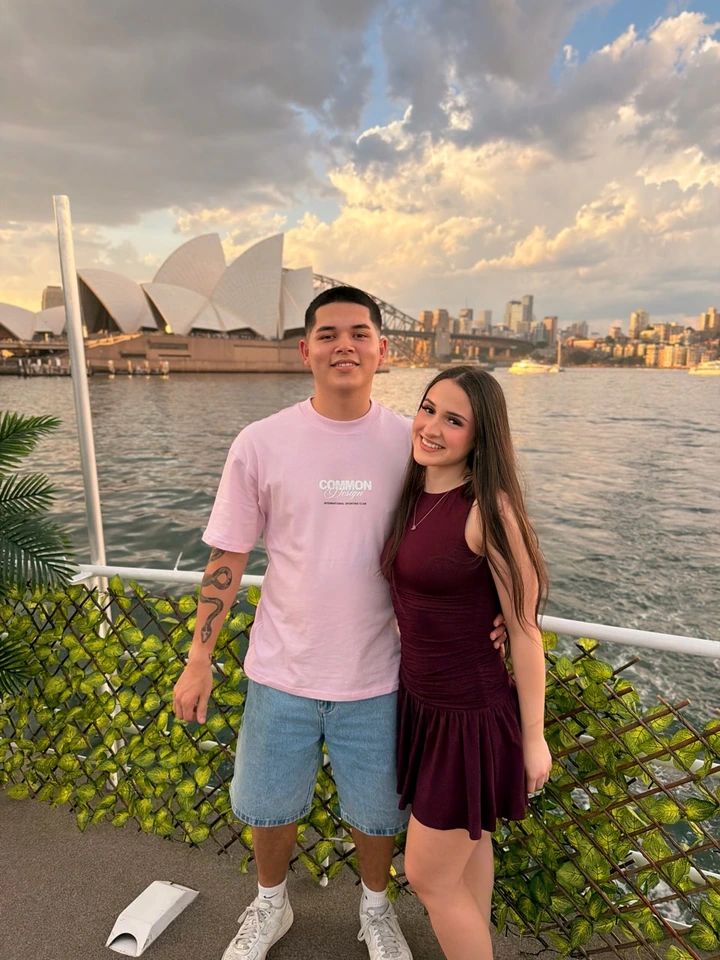 Mat on the left with his partner, Bella, at Sydney Harbour